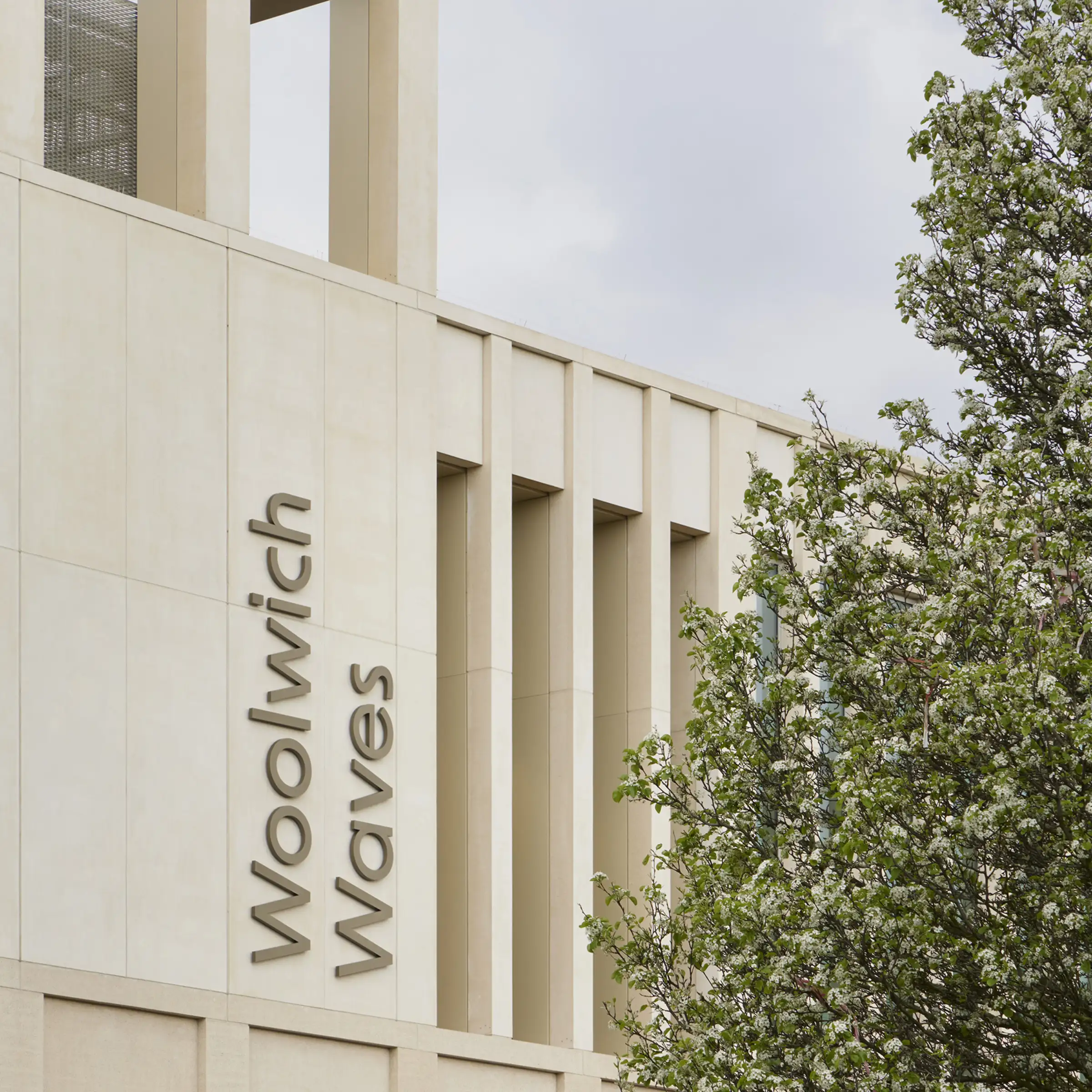 FaulknerBrowns Architects — Woolwich waves leisure centre london signage on facade 3x4
